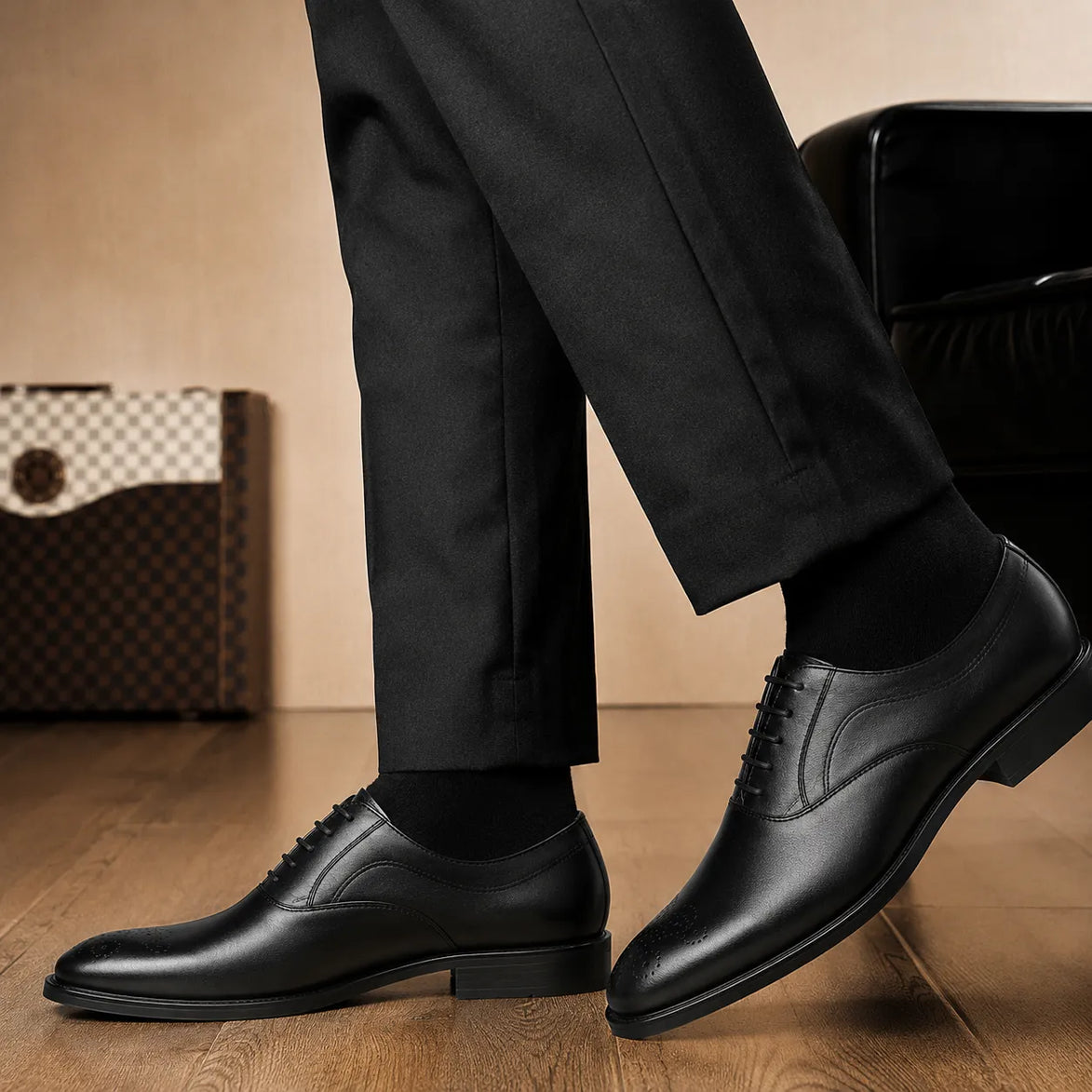 Melodiapelle Meta Wholecut Oxford in nero black leather worn with formal trousers, on-feet shot