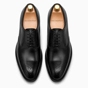 Melodiapelle Meta Wholecut Oxford in nero black leather, pair top-down view, handcrafted in Agra
