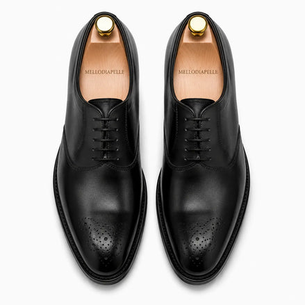 Melodiapelle Meta Wholecut Oxford in nero black leather, pair top-down view, handcrafted in Agra