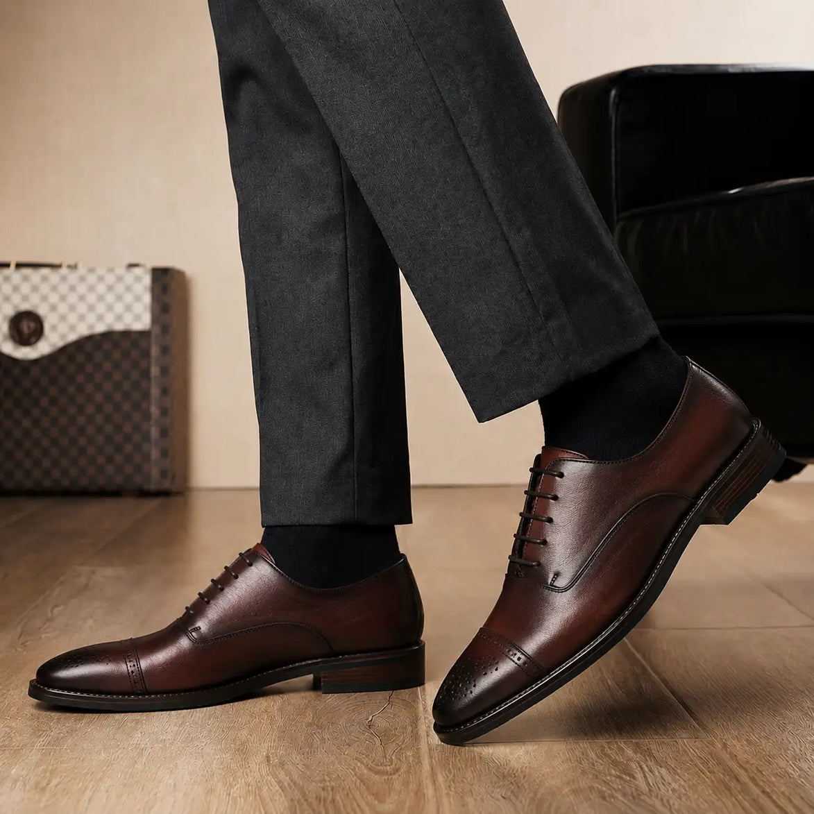 Melodiapelle Meta Wholecut Oxford in oxblood bordeaux leather worn with formal trousers, on-feet shot
