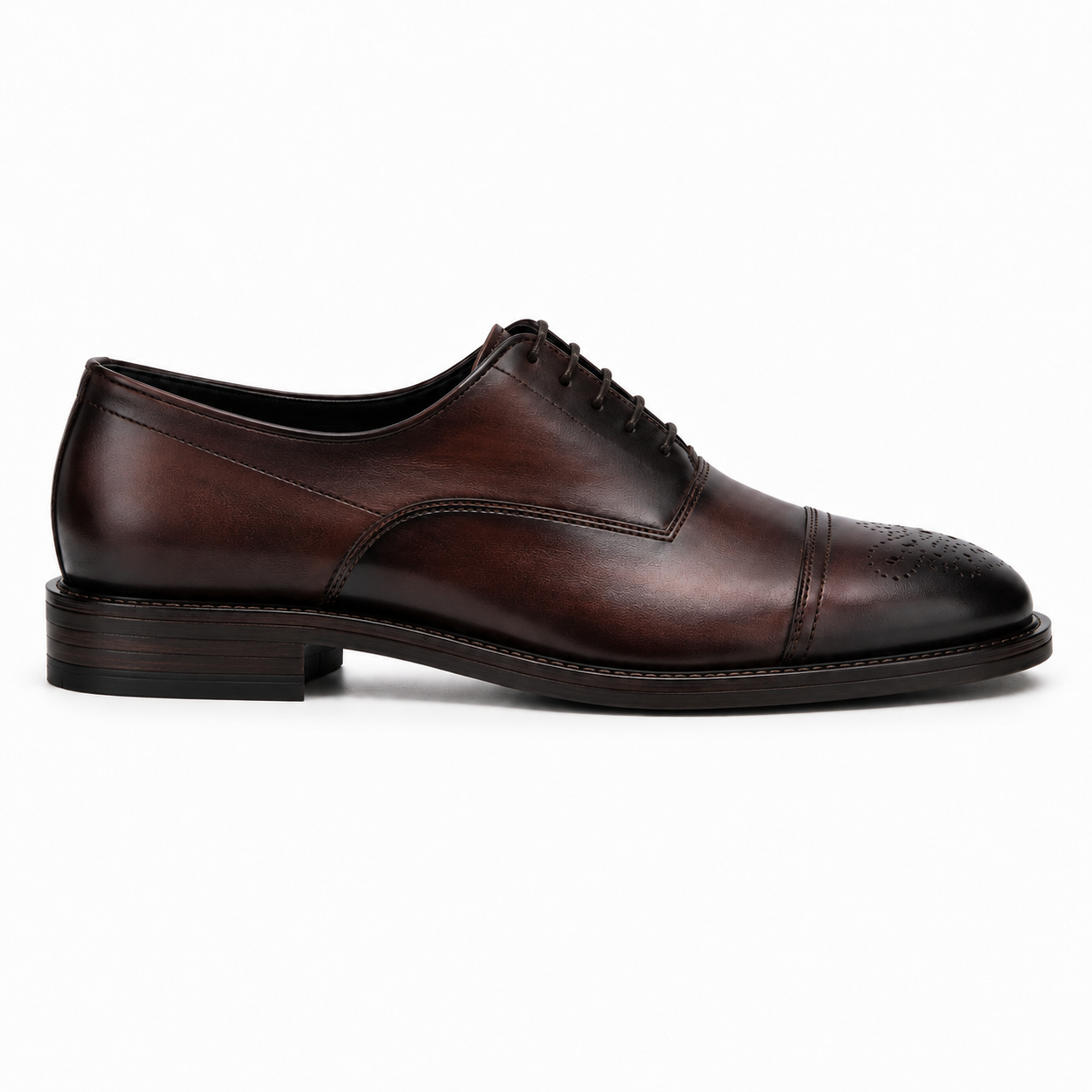 Side profile of the Meta Wholecut Oxford in oxblood bordeaux leather on white background