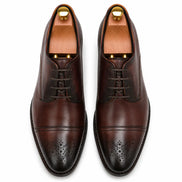 Melodiapelle Meta Wholecut Oxford in oxblood bordeaux leather, pair top-down view, handcrafted in Agra