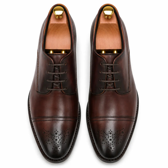 Melodiapelle Meta Wholecut Oxford in oxblood bordeaux leather, pair top-down view, handcrafted in Agra