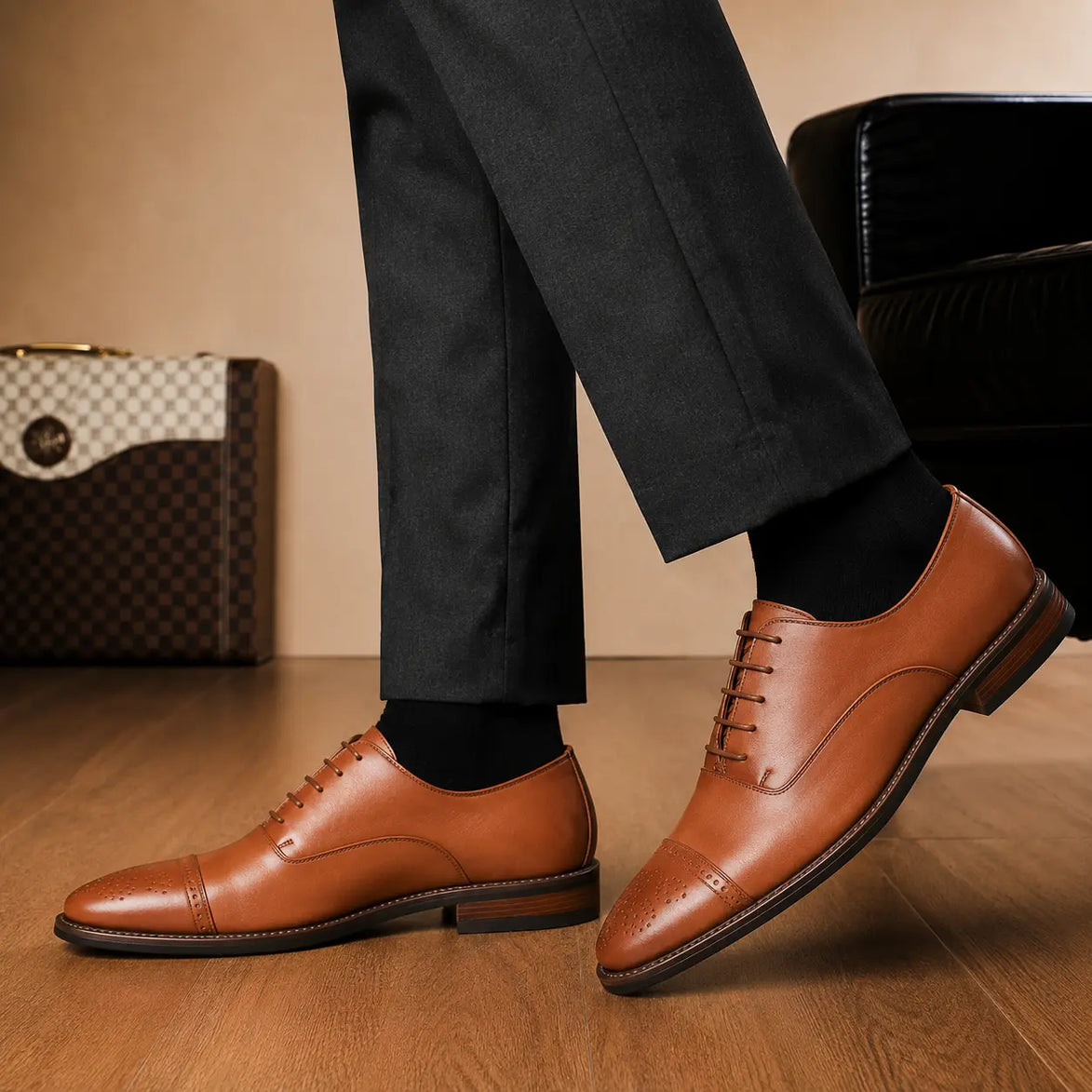 Melodiapelle Meta Wholecut Oxford in tan leather worn with formal trousers, on-feet shot