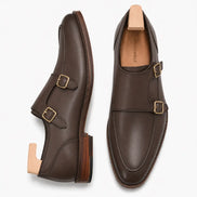 Brown leather double monk strap shoe, three-quarter angle showing buckles and heel