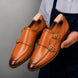 Man holding a pair of Melodiapelle Mexico Double Monk Strap shoes in honey tan burnished leather, close-up