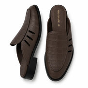Dark brown leather perforated mule, three-quarter angle showing heel and cut-out strap detailing