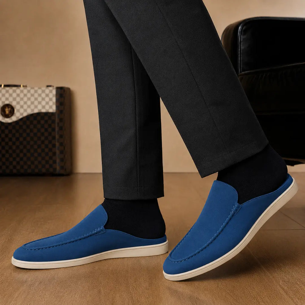 Melodiapelle Michelle Mule in royal blue suede worn with trousers, on-feet shot