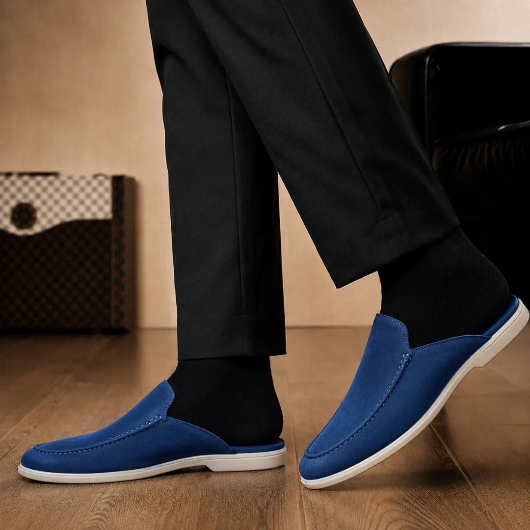 Melodiapelle Michelle Mule in royal blue suede worn with trousers, on-feet shot