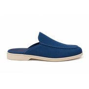 Side profile of the Michelle Mule in royal blue suede on white background