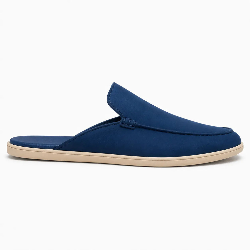 Side profile of the Michelle Mule in royal blue suede on white background