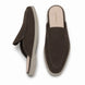 Dark brown suede backless mule slipper, three-quarter angle showing heel and sole detailing