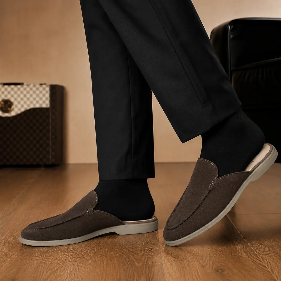 Melodiapelle Mila Mule in dark brown suede worn with trousers, on-feet shot