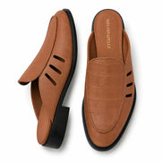 Tan embossed leather perforated mule, three-quarter angle showing heel and texture detailing