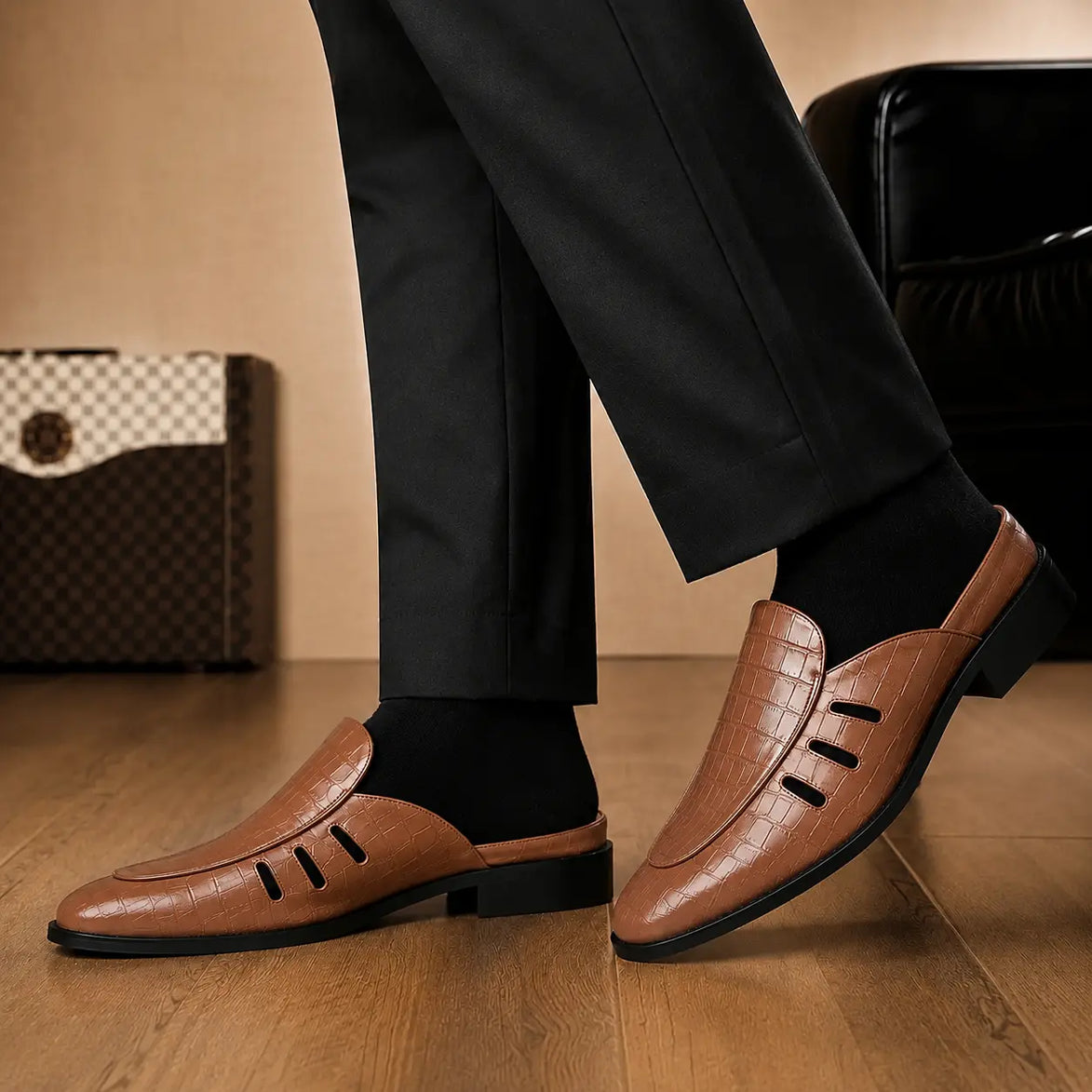 Melodiapelle Milan Mule in tan embossed leather worn with formal trousers, on-feet shot