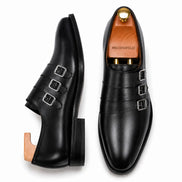 Nero black leather triple monk strap loafer, three-quarter angle showing buckles and heel