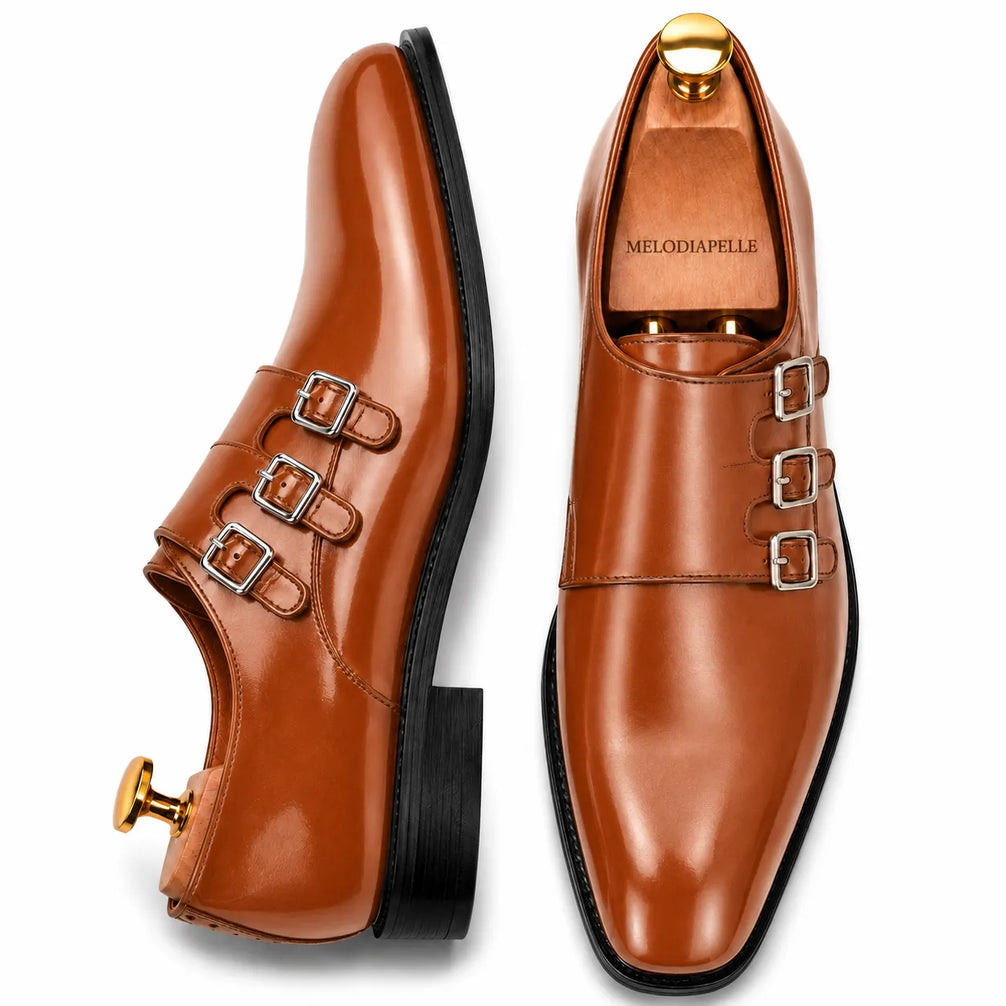 Tan leather triple monk strap loafer, three-quarter angle showing buckles and heel