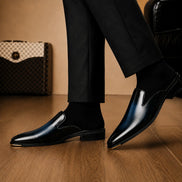 Melodiapelle Millburn Mule in black leather worn with formal trousers, on-feet shot