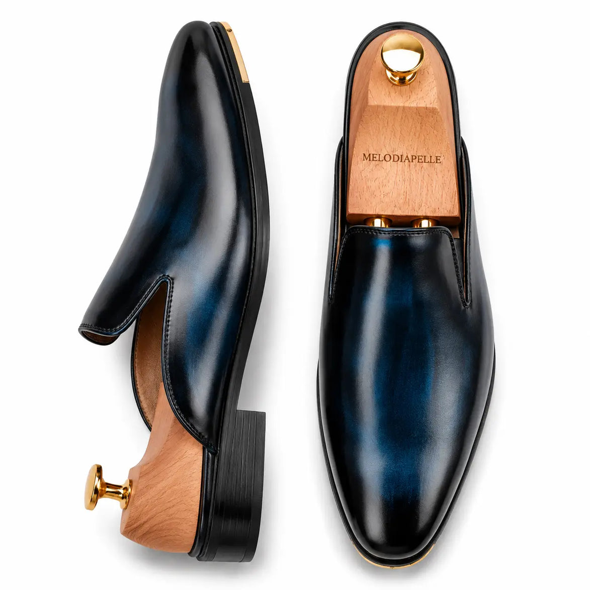Navy blue leather backless mule, three-quarter angle showing sole detailing