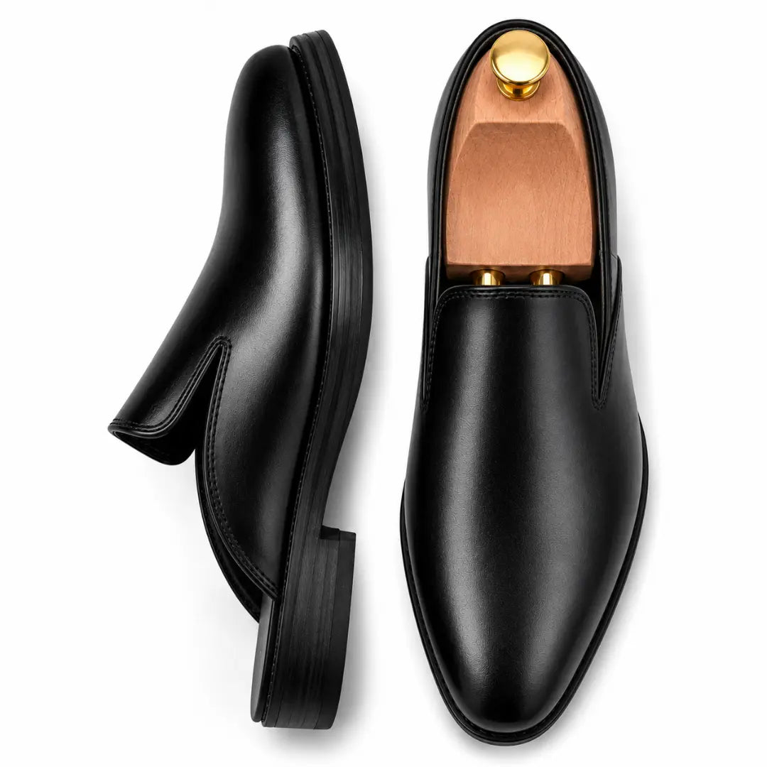 Matte black leather backless mule, three-quarter angle showing sole detailing