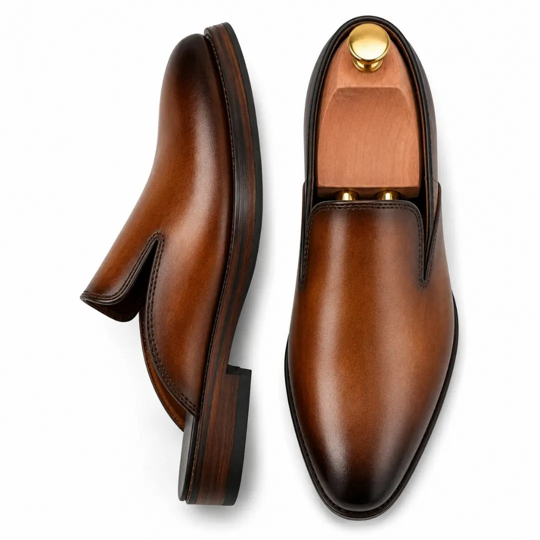 Tan leather backless mule, three-quarter angle showing sole detailing
