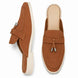 Rust tan suede apron-toe tassel mule, three-quarter angle showing tassel and sole detailing