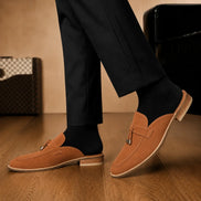 Melodiapelle Millo Mule in rust tan suede worn with trousers, on-feet shot