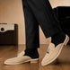 Melodiapelle Millo Mule in sand beige suede worn with trousers, on-feet shot