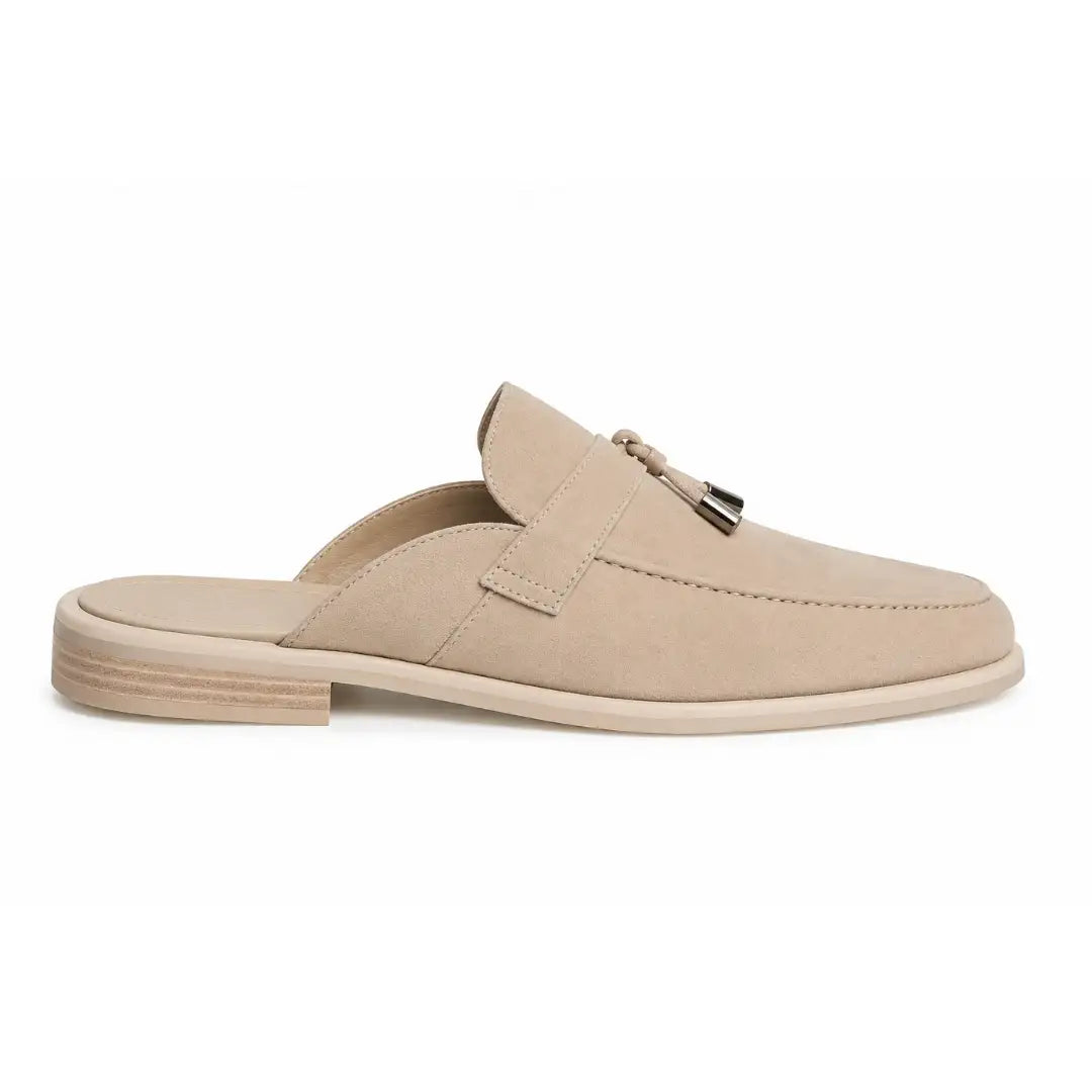Side profile of the Millo Mule in sand beige suede on white background