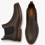 Brown leather Chelsea boot, three-quarter angle showing heel and elastic side panel