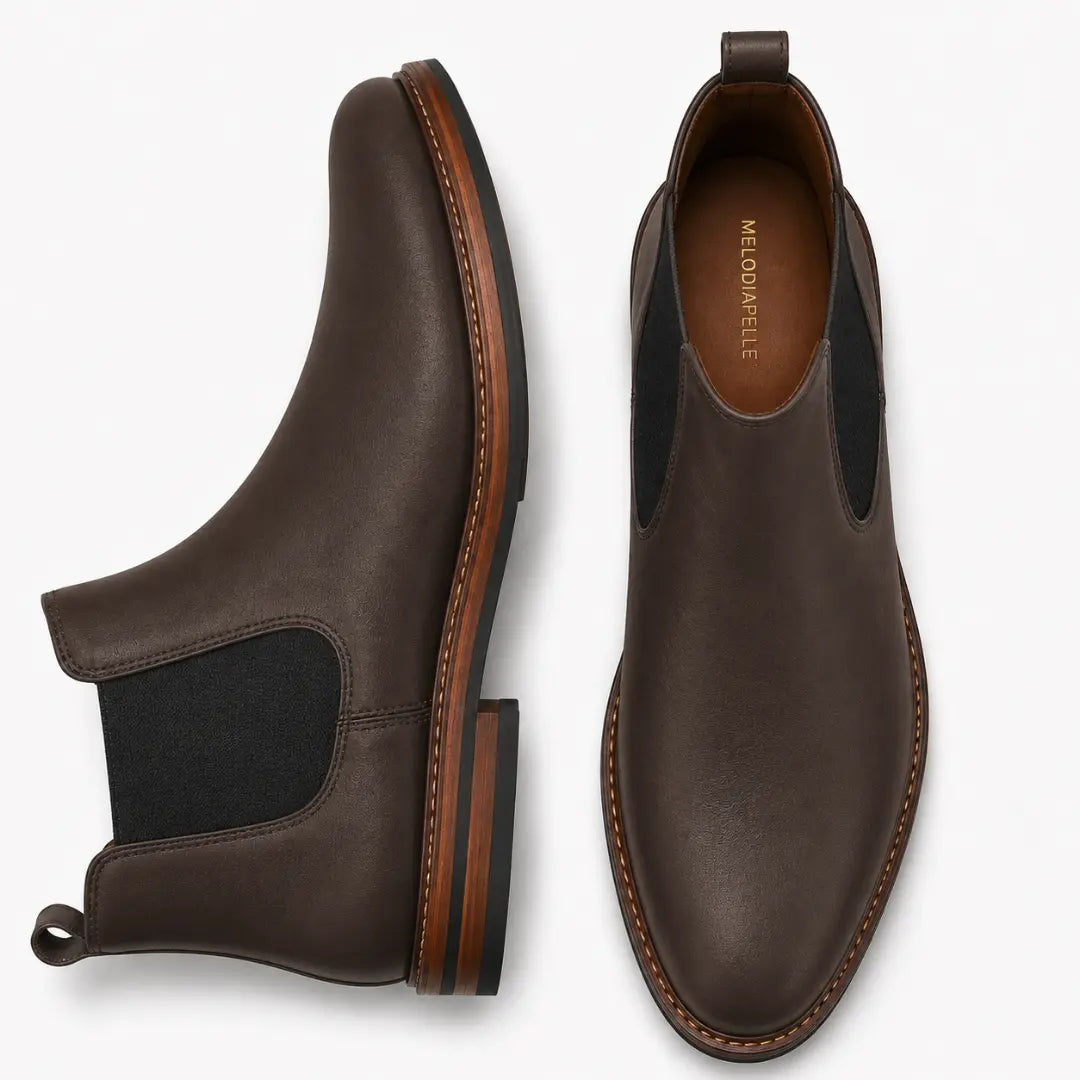 Brown leather Chelsea boot, three-quarter angle showing heel and elastic side panel