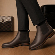 Melodiapelle Mirage Chelsea Boot in brown leather worn with formal trousers, on-feet shot