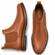 Tan leather Chelsea boot, three-quarter angle showing heel and elastic side panel