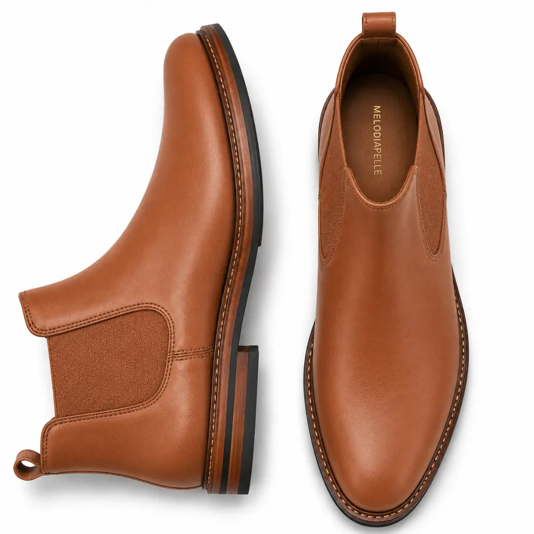 Tan leather Chelsea boot, three-quarter angle showing heel and elastic side panel
