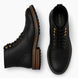 Black leather heritage boot, three-quarter angle showing cap-toe and heel detailing