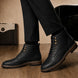 Melodiapelle Miranda Cap Toe Heritage Boot in black leather worn with trousers, on-feet shot