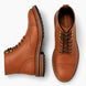 Tan leather heritage boot, three-quarter angle showing cap-toe and heel detailing
