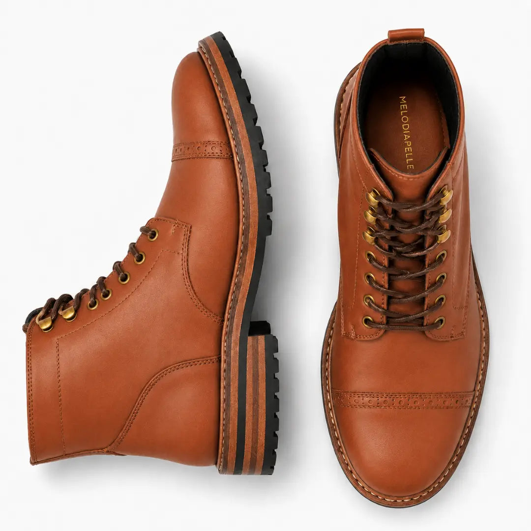 Tan leather heritage boot, three-quarter angle showing cap-toe and heel detailing