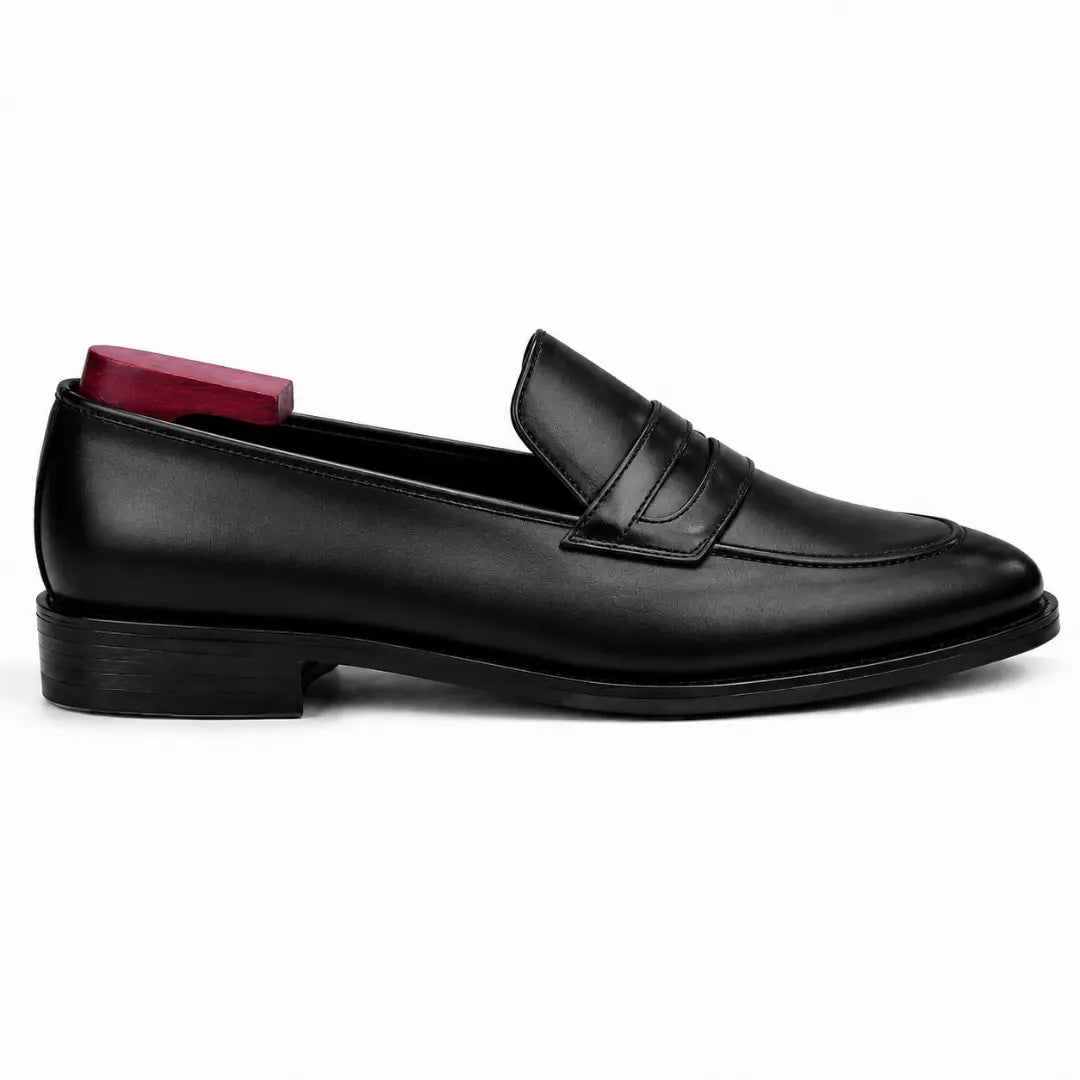 Side profile of the Mirasol Two-Tone Dress Loafer in black leather on white background