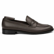 Side profile of the Mirasol Two-Tone Dress Loafer in brown leather on white background