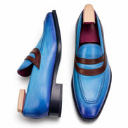 Cobalt blue and burgundy leather dress loafer, three-quarter angle showing band strap and heel