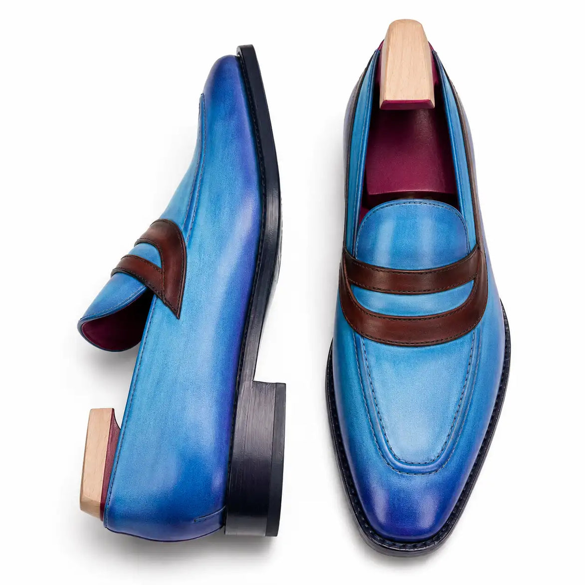 Cobalt blue and burgundy leather dress loafer, three-quarter angle showing band strap and heel
