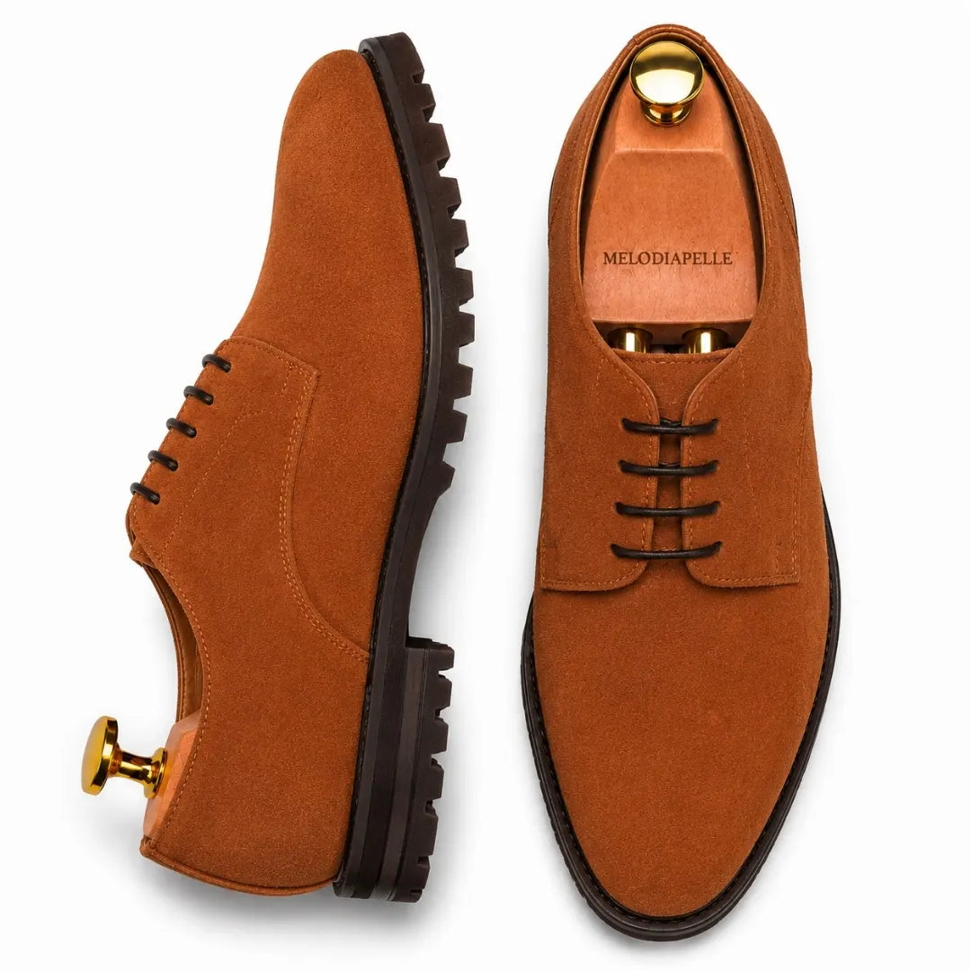 Rust tan suede plain-toe Derby, three-quarter angle showing heel and sole detailing
