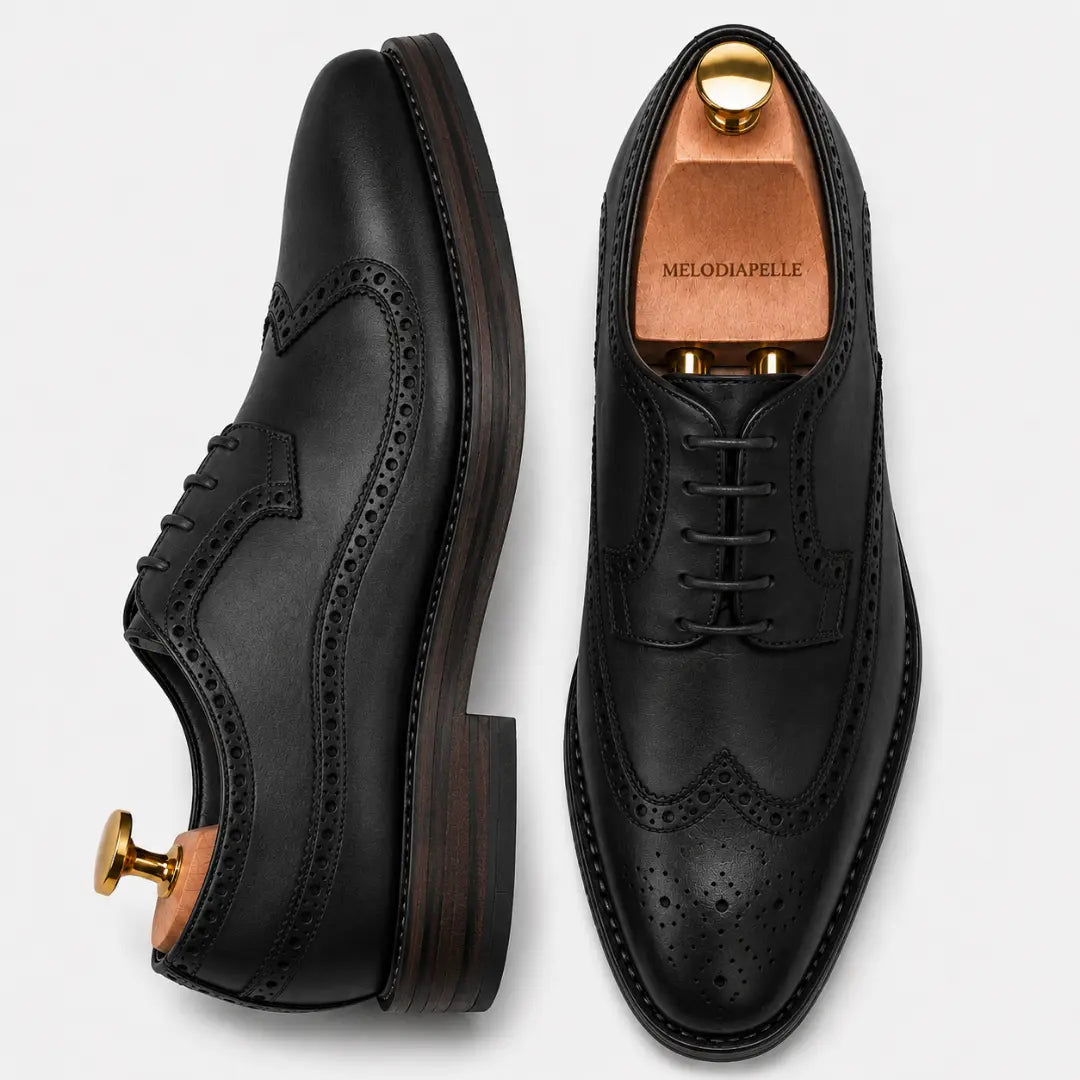 Black leather longwing brogue Derby, three-quarter angle showing heel and brogue detailing