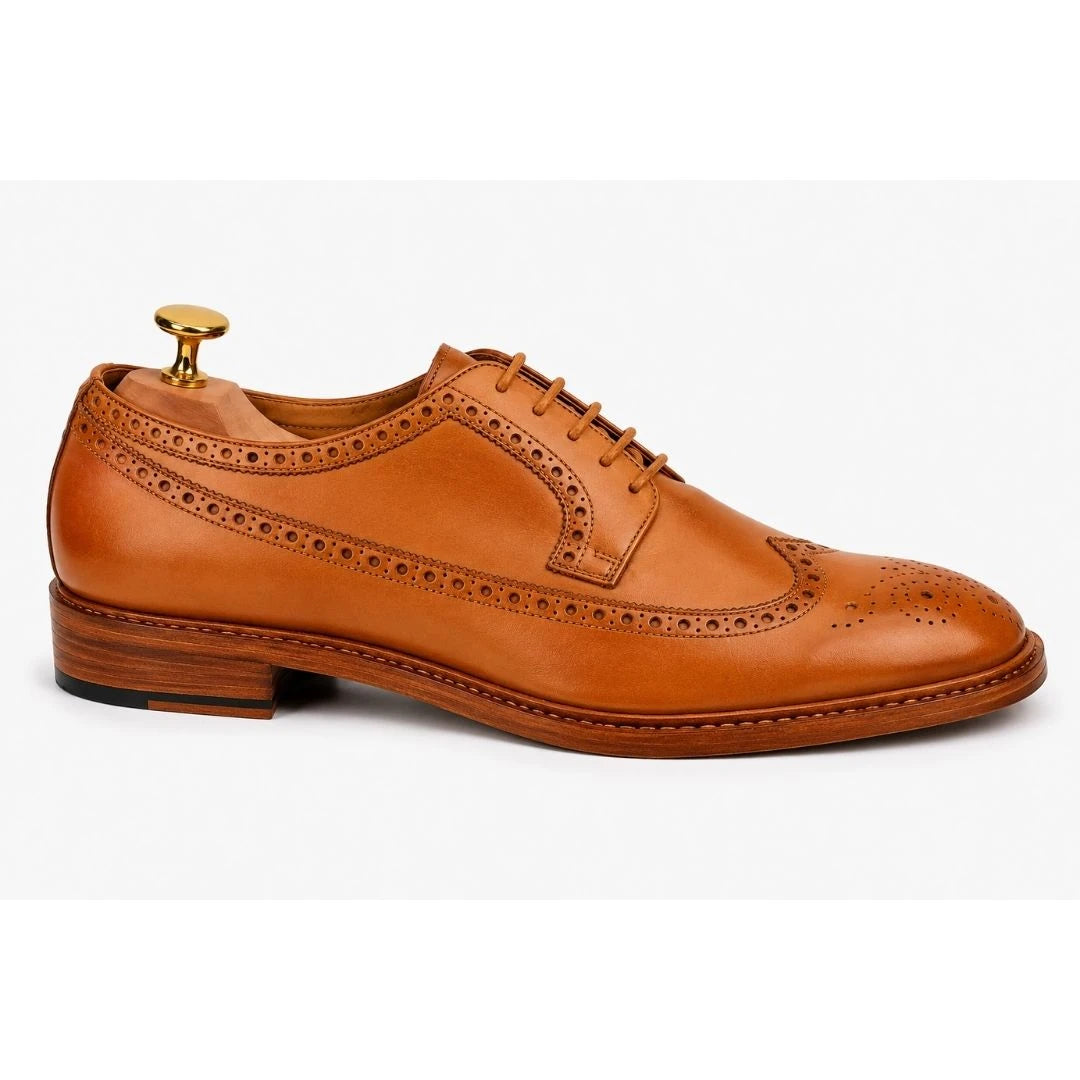 Side profile of the Missourie Longwing Brogue Derby in natural tan leather on white background