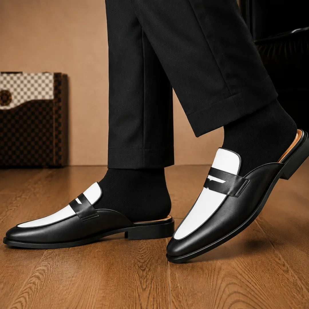 Melodiapelle Modena Mule in black and white leather worn with formal trousers, on-feet shot
