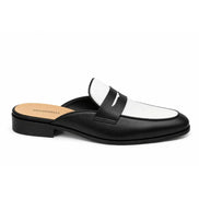 Side profile of the Modena Mule in black and white leather on white background