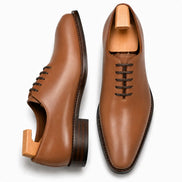 Tan leather wholecut Oxford, three-quarter angle showing seamless upper and heel
