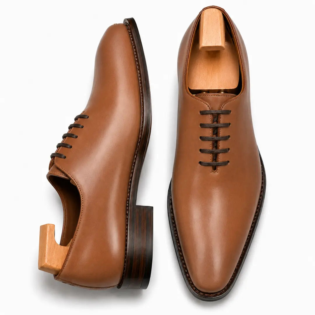 Tan leather wholecut Oxford, three-quarter angle showing seamless upper and heel