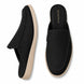 Black suede backless mule slipper, three-quarter angle showing heel and sole detailing